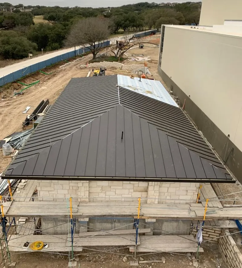 Metal roof new construction with scaffolding in Prunedale