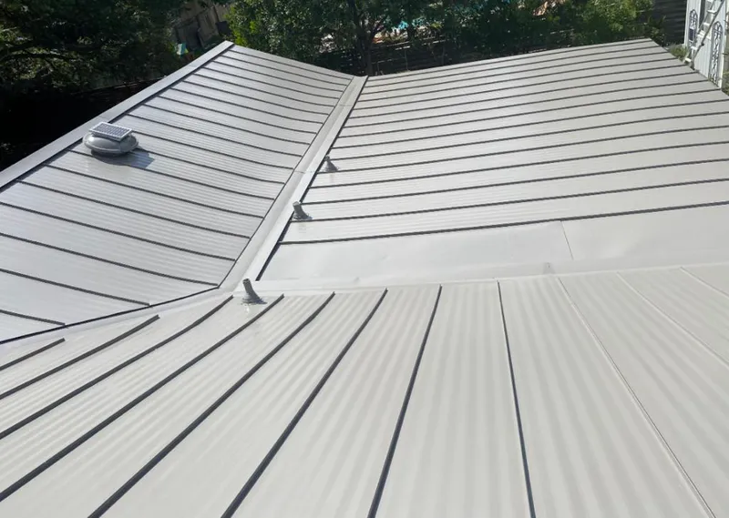 Solar attic fan installed on a metal roof for Roof Ventilation in Prunedale